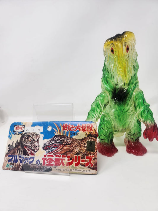HEDORAH (ヘドラ) — M1-GO — マルマック の 怪獣シリーズ (BULLMARK NO KAIJU SERIES) — 世紀の大怪獣 (SEIKI NO DAIKAIJU) — SOFUBI TRANSLÚCIDO VERDE/AMARILLO/ROJO — TM & © 1971/2007 TOHO CO., LTD. — c.2006/2007