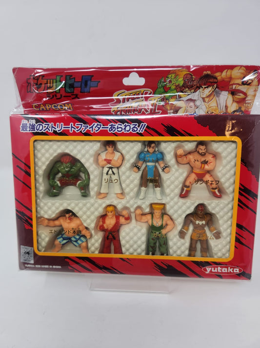Capcom × Yutaka — ポケットヒーローシリーズ — ストリートファイターII — Pocket Hero Series Street Fighter II — 8 Minifiguras PVC — Edición Japonesa, 1993 — Sellada en Blister Original
